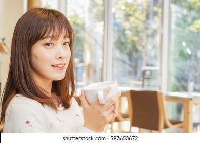 Young woman relaxing at cafe