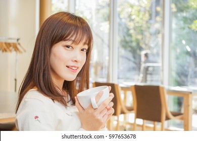 Young woman relaxing at cafe