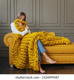 Young Woman Relaxing With Chunky Merino Wool Blanket. Relax, Comfort Lifestyle. Winter Style.