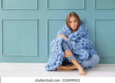 Young Woman Relaxing With Chunky Merino Wool Blanket. Relax, Comfort Lifestyle. Winter Style.