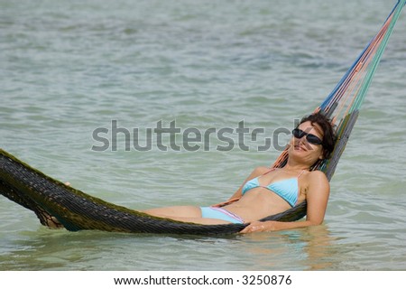 Young woman relaxing in a hammock