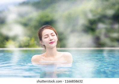 Young  Woman Relaxing In Hot Springs 