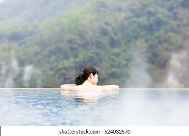 Young Woman Relaxing In  Hot Springs