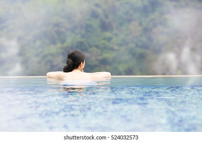 Young Woman Relaxing In  Hot Springs