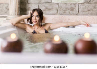 Young Woman Relaxing In The Hot Tub