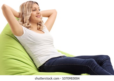 Young Woman Relaxing On A Beanbag Isolated On White Background