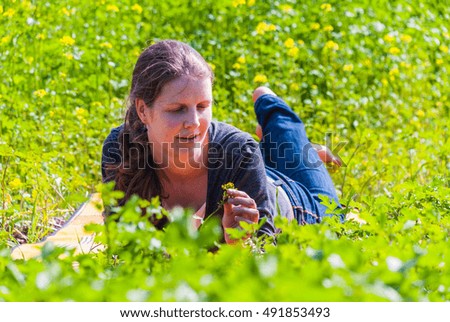 Similar – Lachend im Gras liegend, Augen geschlossen.