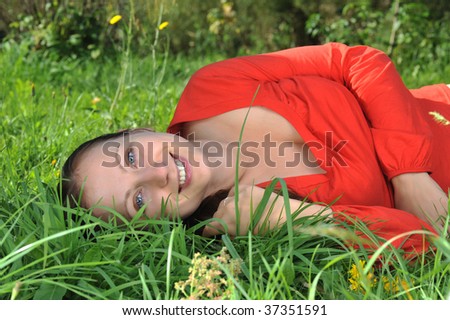 Similar – Lachend im Gras liegend, Augen geschlossen.