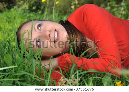 Similar – Lachend im Gras liegend, Augen geschlossen.