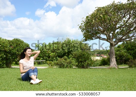 Young woman relaxing at the park