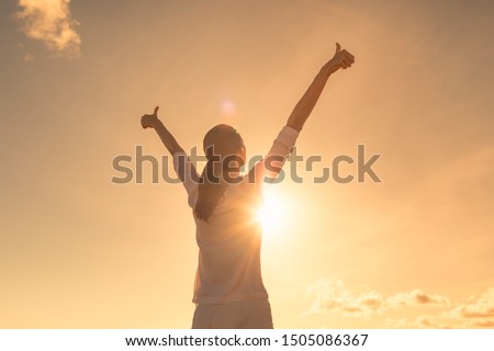 Young woman relaxing in summer sunset sky outdoor. People freedom, feeling, positive lifestyle.