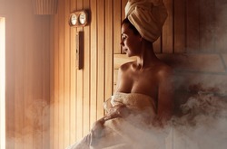 Young Woman Relaxing And Sweating In Hot Sauna Wrapped In Towel. Girl In Sauna. Interior Of Finnish Sauna, Classic Wooden Sauna With Hot Steam. Russian Bathroom. Relax In Hot Bathhouse With Steam.
