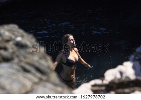 Young woman relaxing swimming at sea lagoon