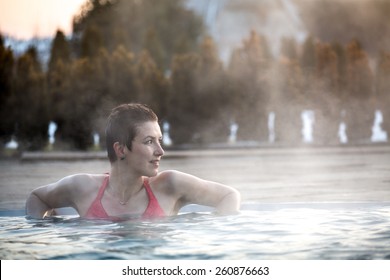 Young Woman Relaxing In Thermal Pool.