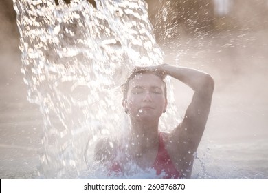 Young Woman Relaxing In Thermal Pool.