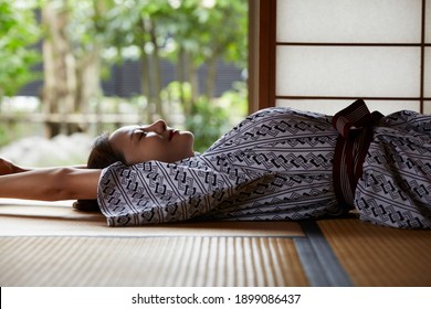 A young woman is relaxing at a traditional Japanese inn