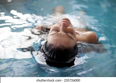 Young woman relaxing in the water  - Powered by Shutterstock