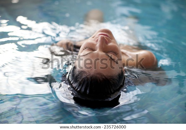 Young woman relaxing in the\
water 