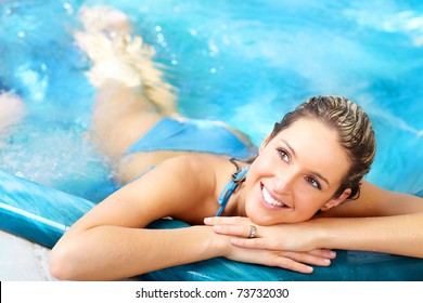 Young woman relaxing in the water. Summer.