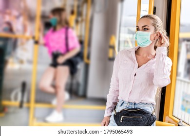 Young Woman With Respiratory Mask Traveling In The Public Transport. Public Transport During The Coronavirus - Concept. Coronavirus, Covid 2019