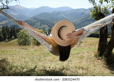 Young woman resting in hammock outdoors on sunny day - Powered by Shutterstock