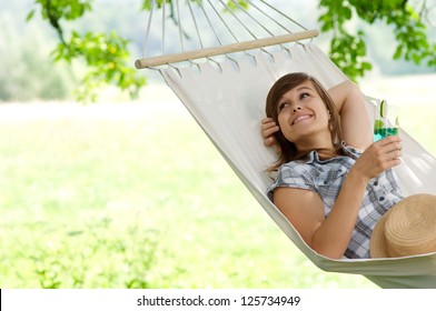 Young Woman Resting On Hammock