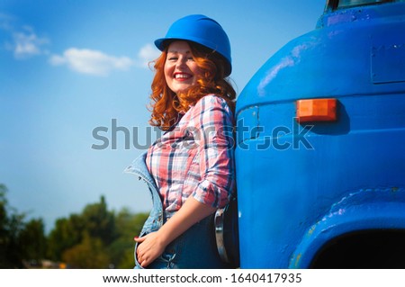 Young woman in retro pin-up style and a truck