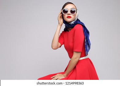 Young Woman In Retro Style. Sunglasses And Silk Scarf. Sixties Style Fashion Retro Woman. 