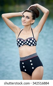 Young Woman In A Retro Swimsuit Posing Outdoors 