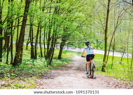 Similar – Radfahrer auf Waldweg