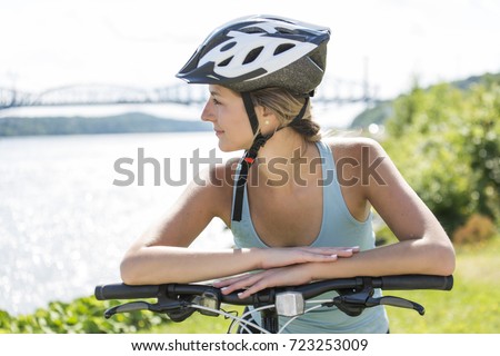 Young Woman Riding Bike outside