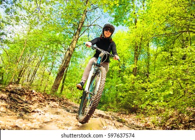 Young Woman Riding Her Mountain Bike