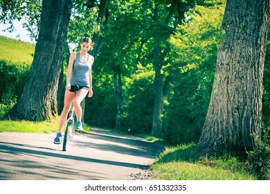 Young Woman Riding Her Unicycle Stock Photo (Edit Now) 651332335