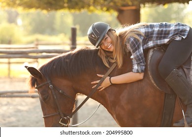 Young Woman Riding Horse