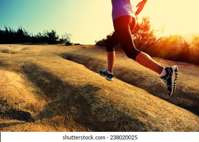 Young Woman Runner Legs Running On Mountain Trail 