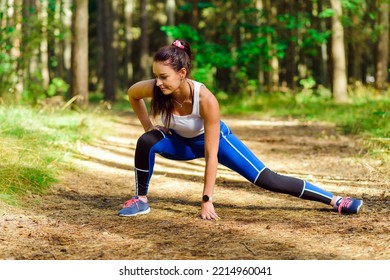 Young Woman Runner Stretching Legs Before Exercising At Summer Park Morning 30s Athletic Female Warming Up Body Before Running Caucasian Person Warm Up Jogging.Summer,spring Morning.