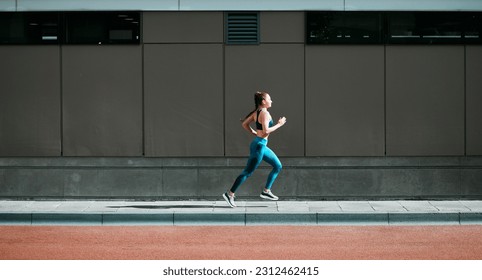 Young woman, running and city sidewalk with training, exercise and fitness on urban road. Street, runner profile and female athlete with mockup and body workout for health, wellness and race outdoor - Powered by Shutterstock