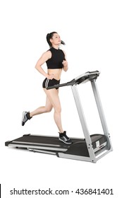 Young Woman Running On Treadmill