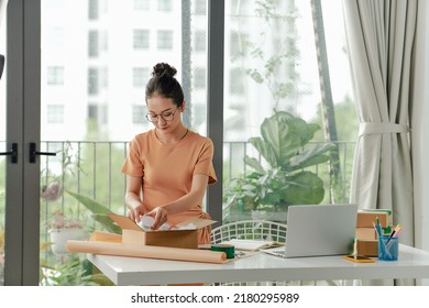 Young Woman Running Online Cosmetic Store Packing Goods For Dispatch