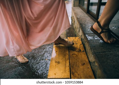 Young Woman Running In The Rain Without Umbrella