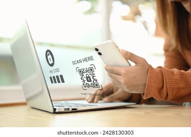 Young woman scanning QR code and entering verification code. Cybersecurity concept