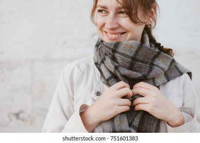 Young woman in scarf is smiling