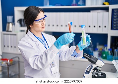 Young Woman Scientist Holding Test Tubes At Laboratory