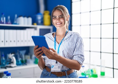 Young Woman Scientist Using Touchpad Working At Laboratory