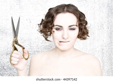 Young Woman With Scissors Looking Crafty