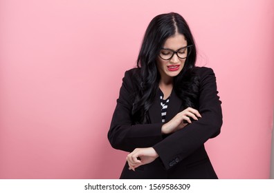 Young Woman Scratching Her Itchy Arm. Skin Problem.