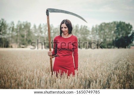 Image, Stock Photo beautiful and mysterious girl with scythe