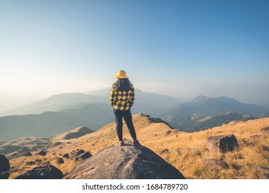 young woman see view on top mountain, view point with blue sky at Mulayit Taung, Myanmar. soft focus and vintage tone. - Shutterstock ID 1684789720