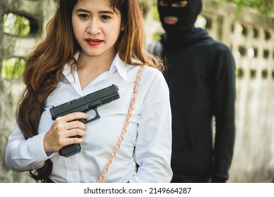 Young Woman Self Defence Putting Gun In Her Small Handbag, Female Hide Gun In His Chest, Self-defense Criminal Concept