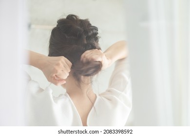 Young Woman Setting Her Hair